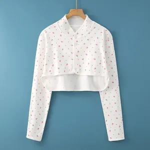 White cotton shoulder warmer crop cardigan with pink strawberry print and white buttons