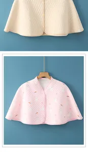 Detail of quilted nursing shoulder wraps in heart and rabbit patterns for warmth