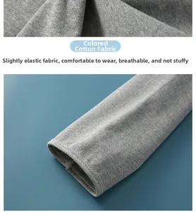 Détail macro du tissu en coton coloré respirant et coutures soignées sur l'épaulière