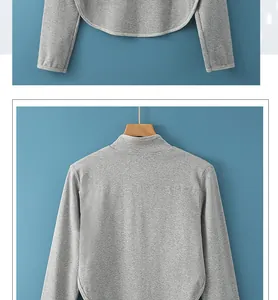 Détail de chauffe-épaule en coton gris avec texture tricotée et ourlet arrondi