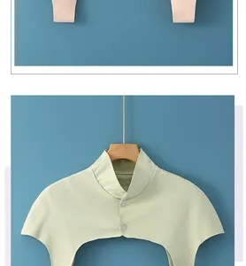 Detailed view of light green neck warmer with stand collar and transparent buttons