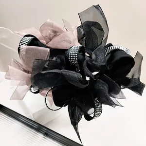 Elegant oversized organza bow scrunchie with silver rhinestones in black and pink