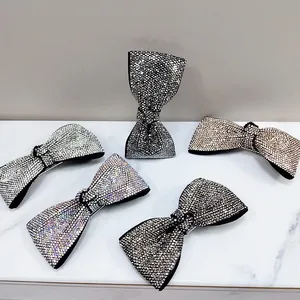 Detailed set of five sparkling rhinestone bow hair clips in assorted elegant colors