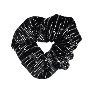 Elegant black velvet scrunchie with silver rhinestone stripes for a French retro hairstyle