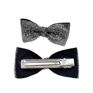 Elegant black bow hair clip with silver rhinestones and metal duckbill clip