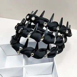 Detail of punk style black headband with metallic studs and sparkling rhinestones