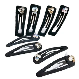 8-piece black fabric BB hair clips set with sparkling rhinestones in various shapes
