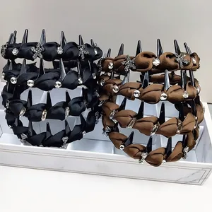 Macro detail of punk style spiked headbands with rhinestones and star ornaments