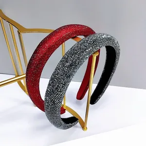 Detailed macro view of two padded headbands featuring red and silver shimmering rhinestones