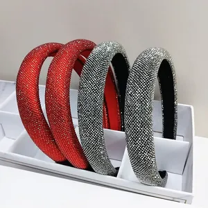 Macro shot of padded baroque headbands with sparkling rhinestones in red and silver
