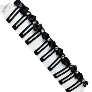Elegantes 12er-Set schwarze Schleifen-Haarspangen mit Strasssteinen auf weißer Karte