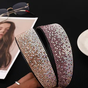 Sparkling wide padded headband with multi-color rhinestones on black leather base
