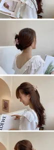 Detail showing elegant rhinestone flower hair claw clip worn in various hairstyles