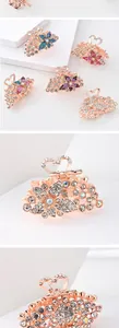 Close-up of heart-shaped hollow metal clip and colorful rhinestones on butterfly hair claw