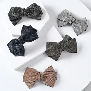 Sparkling rhinestone bow hair clips in black, navy, silver, grey, and champagne gold