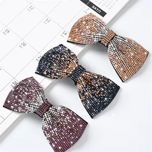 Sparkling rhinestone bow hair clips in champagne, navy blue, and pink purple colors