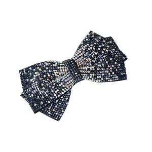 Elegant bow hair clip with sparkling colorful rhinestones on a minimalist white background