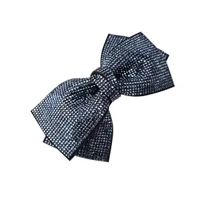 Sparkling blue rhinestone bow hair clip with textured crystal embellishments for women
