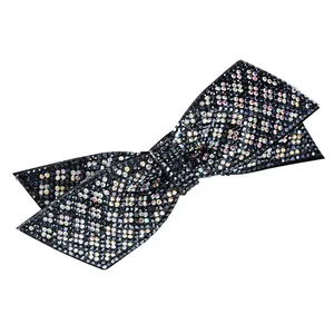 Elegant bow hair clip with black and iridescent rhinestones on a clean white background