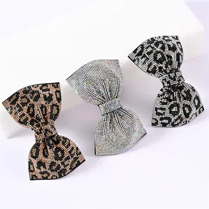 Barrettes à cheveux n?ud avec strass et motif léopard en coloris argent et doré