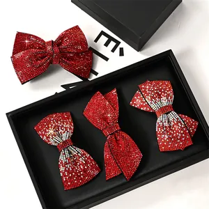 Red rhinestone bow hair clips in a black luxury gift box for New Year headwear