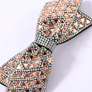 Double-layered black bow hair clip featuring sparkling rhinestones and rose gold sequins