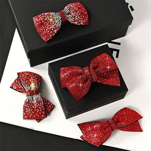 Elegant set of red rhinestone bow hair clips in a premium gift box for New Year