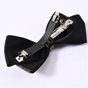 Elegant black satin bow hair clip with sparkling rhinestones and metal spring clasp