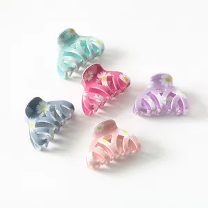 5-piece set of candy-colored daisy hair claws in mint green, pink, and purple colors