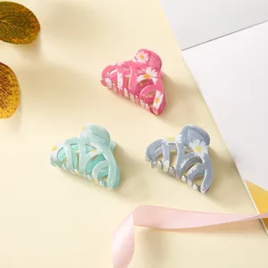 Three-piece daisy floral hair claw clips set in candy pink mint green and grey blue