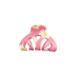 Pink daisy floral hair claw clip with white flower pattern for elegant hair styling