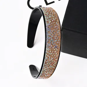 Detailed side view of vintage wide headband with sparkling rhinestones and anti-slip teeth