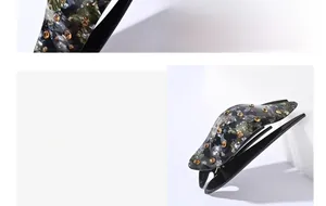 Macro detail of marble-textured resin hair clip with amber rhinestones and side view