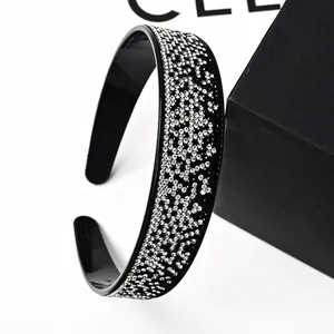 Detailed macro view of wide-brimmed headband with rhinestones and non-slip inner teeth