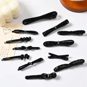 Juego de 11 pinzas para el cabello de diamantes negros con lazos y diseños de corazón