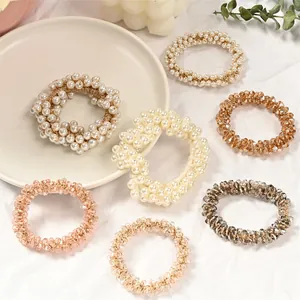 Elegant pearl and crystal beaded hair ties in various colors for stylish ponytails