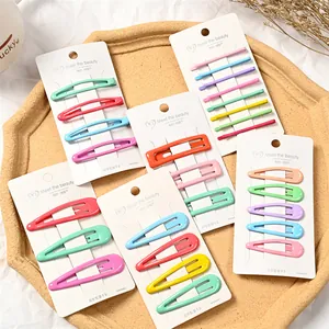 Set de horquillas de colores macaron con formas de gota y cuadradas en tarjeta blanca