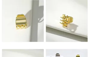 Detailopname van kleine gouden metalen haarklemmen met hoogglans afwerking en veerontwerp