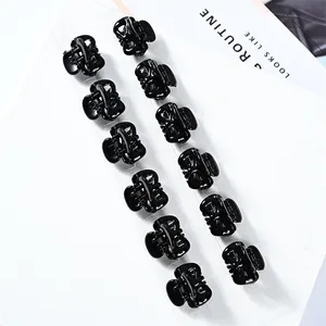 Mini butterfly hair clips in black 12-piece set on card for styling bangs