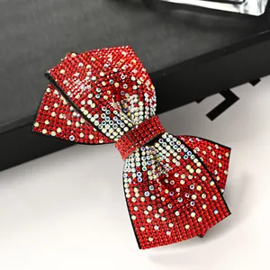 Handmade red rhinestone bow hair clip with sparkling crystals and black base
