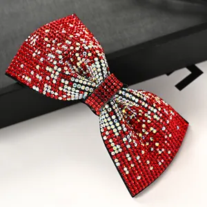 Sparkling bow hair clip with red and silver rhinestones in a layered spring clip style