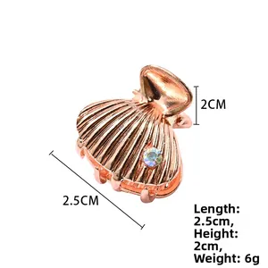 Rose gold shell claw clip detail with rainbow rhinestone and 2.5cm size dimensions