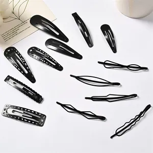Set de 11 pinzas para el cabello de metal negro mate con diseños de corazón y gota