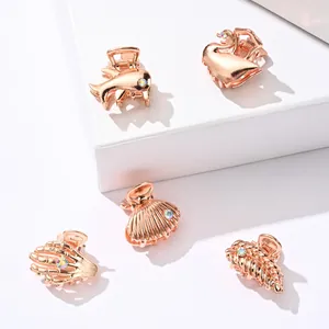 Mini rose gold metal hair claws set with animal shapes and rainbow rhinestones