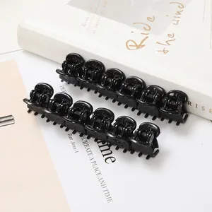 Set of 12 mini black butterfly hair clips with glossy finish and metal springs