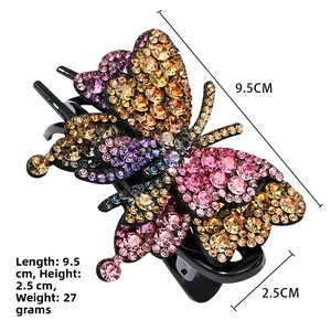 Dettaglio del fermaglio per capelli a farfalla con strass rosa e viola di lusso, 9.5cm
