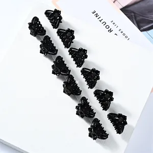 Set of 12 mini black floral hair claws with glossy finish and golden metal springs