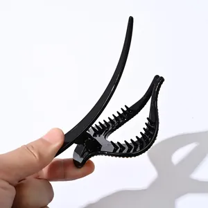Pinza para el cabello elegante de resina negra con pedrería ámbar para peinado mujer