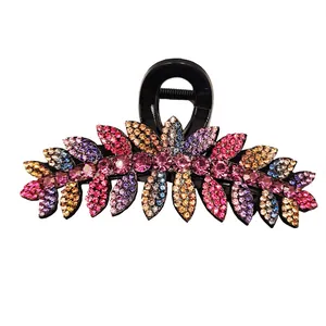 Sparkling rhinestone leaf hair claw clip for women with colorful crystals on white background