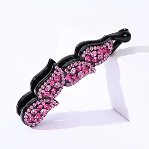Barrette banane en acrylique noir avec strass roses pour une coiffure en queue de cheval